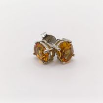 A pair of citrine studs, in silver