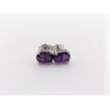 A pair of amethyst studs, in silver
