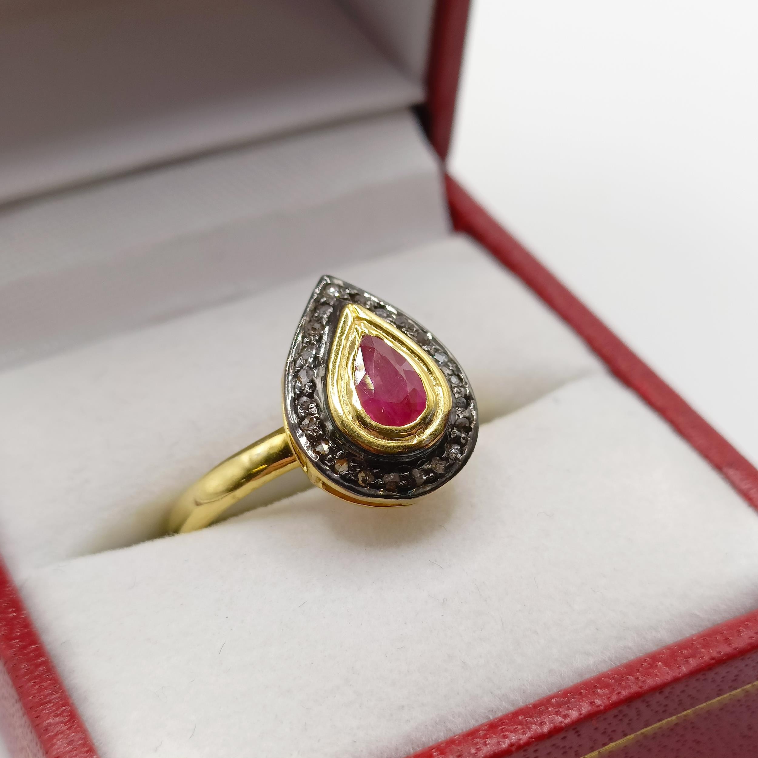 A pear shaped ring, set with pear shaped ruby and halo of R/C diamonds set in gold-plated silver, - Image 2 of 7