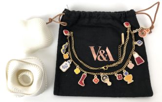 An expanding bracelet and matching ring, boxed, and a plastic and gilt metal chain