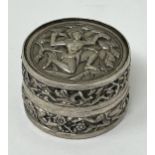 An Indian silver coloured metal pill box, decorated a figure, 19.2 g