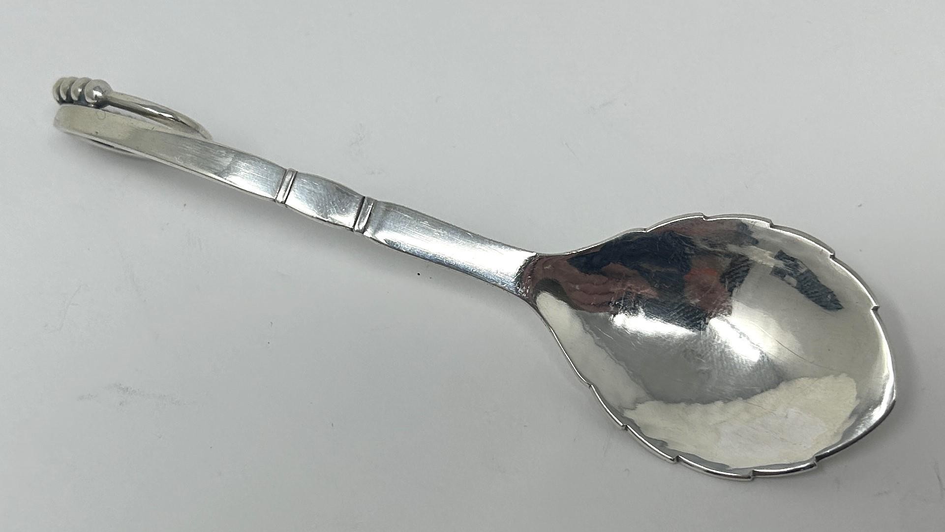 A Danish silver coloured metal spoon, by Georg Jensen, 32.4 g Approx. length: 15 cm - Image 2 of 5