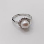 A 9ct white gold cultured pearl and R/C diamond halo ring, boxed, diamonds 0.37ct, ring size N