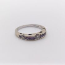 An 18ct white gold, diamond and pink stone half eternity ring, ring size L