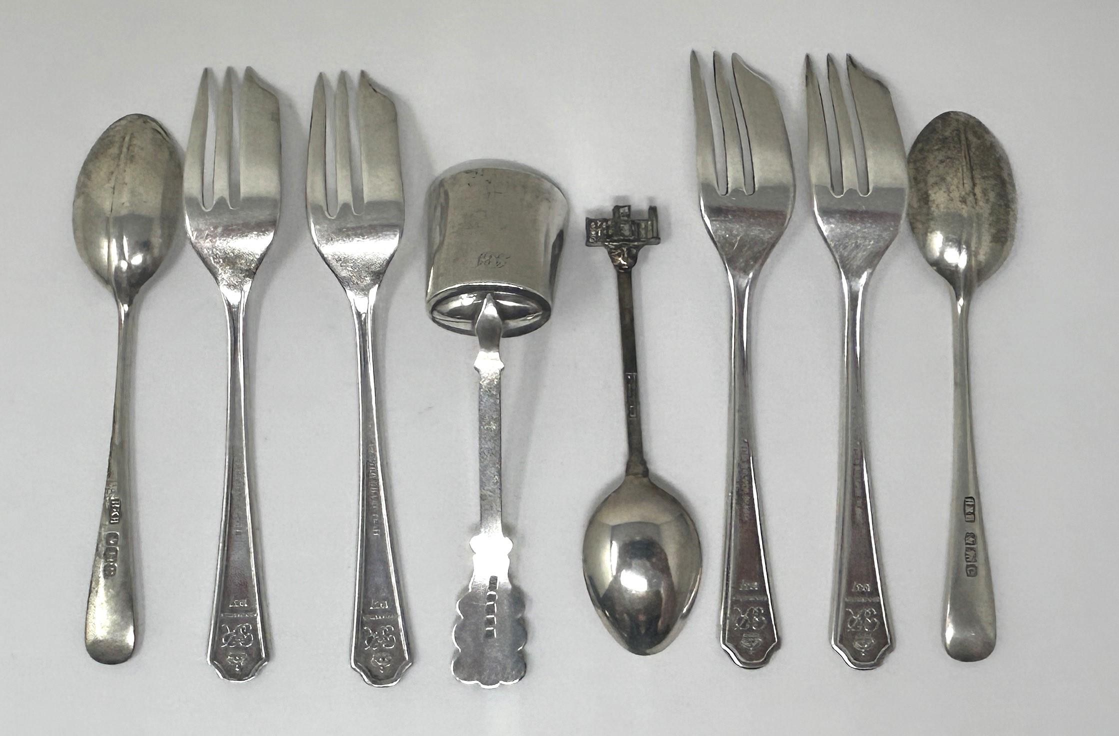 A Continental silver coloured metal sugar scoop, a set of four silver plated cake forks, two - Image 2 of 3