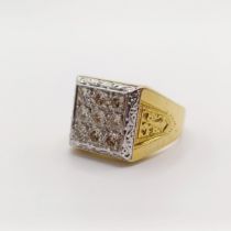 An 18ct yellow and white gold, diamond checkerboard-style panel ring, with detailing around the