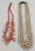A simulated pearl necklace, and a coral necklace