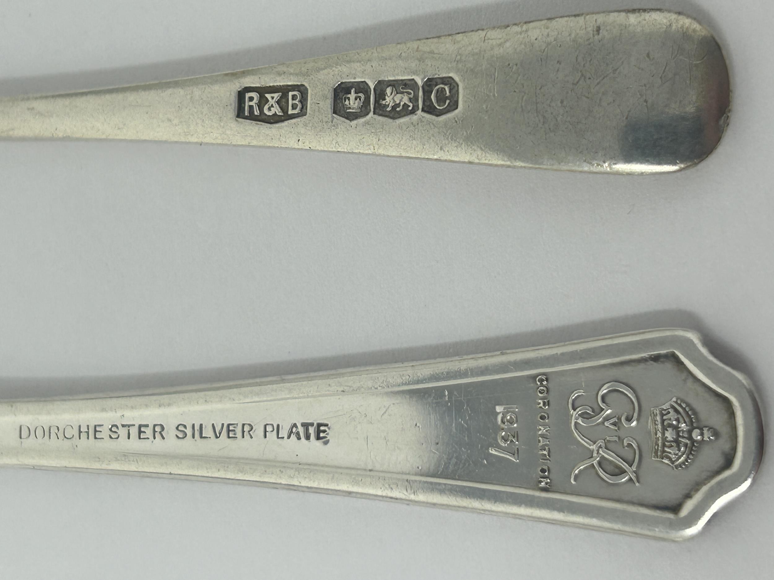 A Continental silver coloured metal sugar scoop, a set of four silver plated cake forks, two - Image 3 of 3