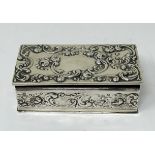 A sterling silver stamp box