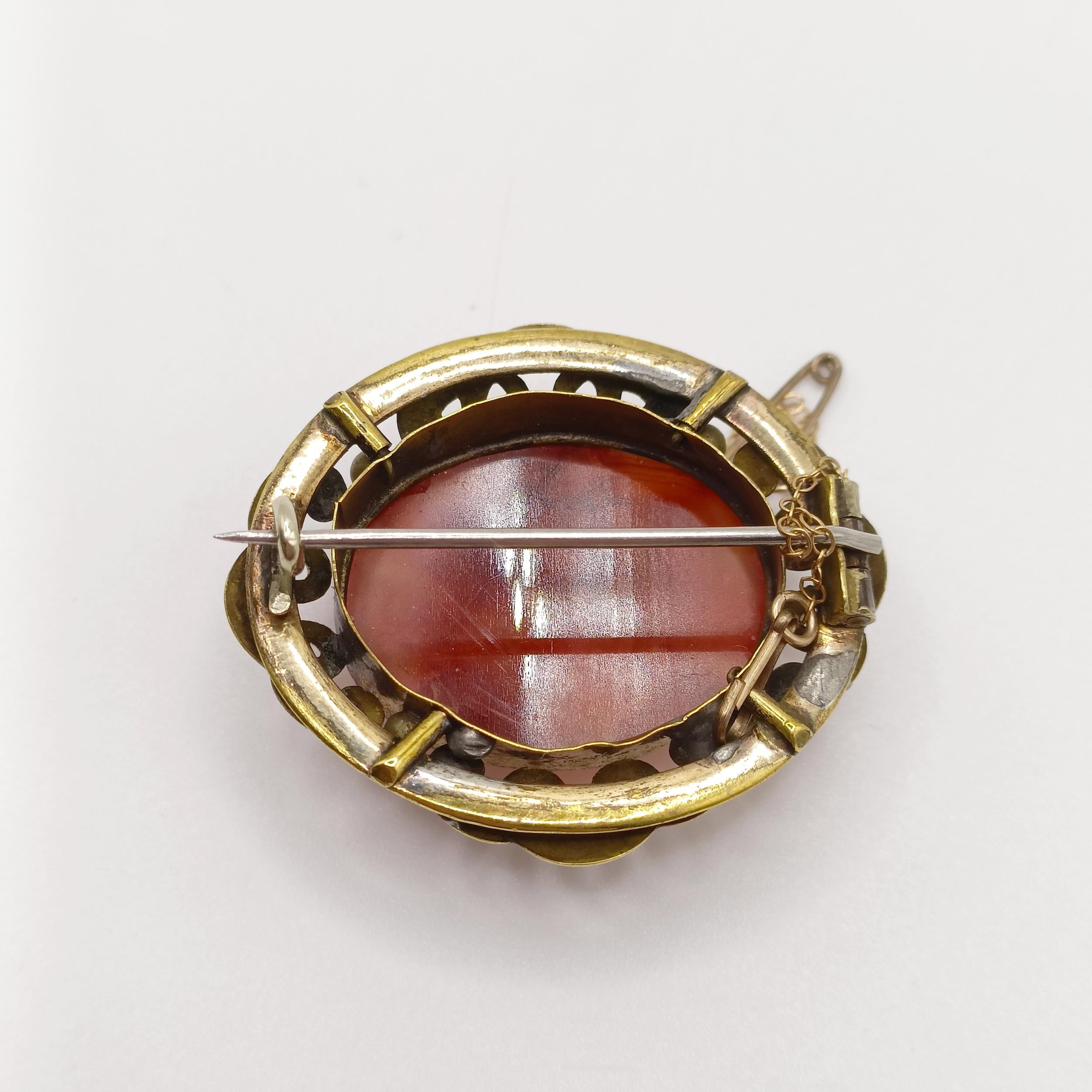 An early 20th century yellow coloured metal and amber coloured stone brooch, and a yellow metal - Image 5 of 6