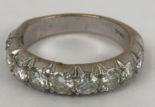 An 18ct white gold and diamond half eternity ring, ring size M