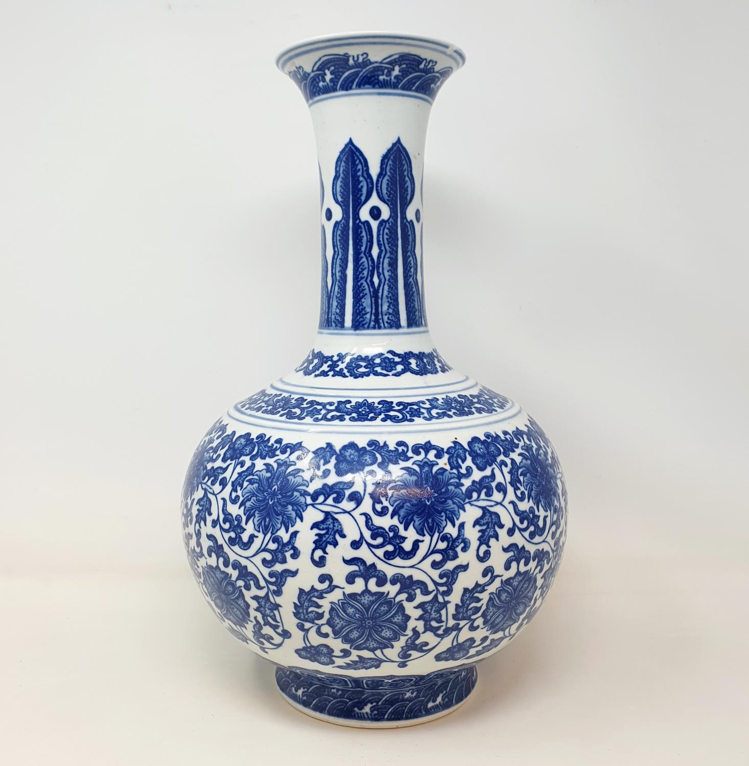 A Chinese blue and white bottle vase, decorated flowers in underglaze blue, bears a Qianlong mark, - Image 5 of 13