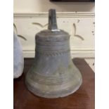A bronze bell, 22 cm diameter Heavily repaired
