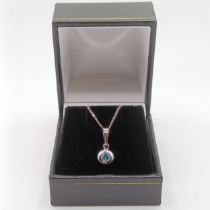 A 14ct white gold and blue diamond pendant, with a silver chain, boxed, RBC diamond 0.20ct