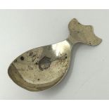 A Continental silver coloured metal novelty caddy spoon, in the form of a whale, marks rubbed, 8.7 g