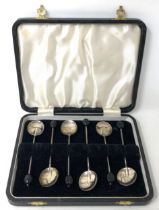 A set of six George V silver and green enamel coffee spoons, and a set of six coffee spoons (12)