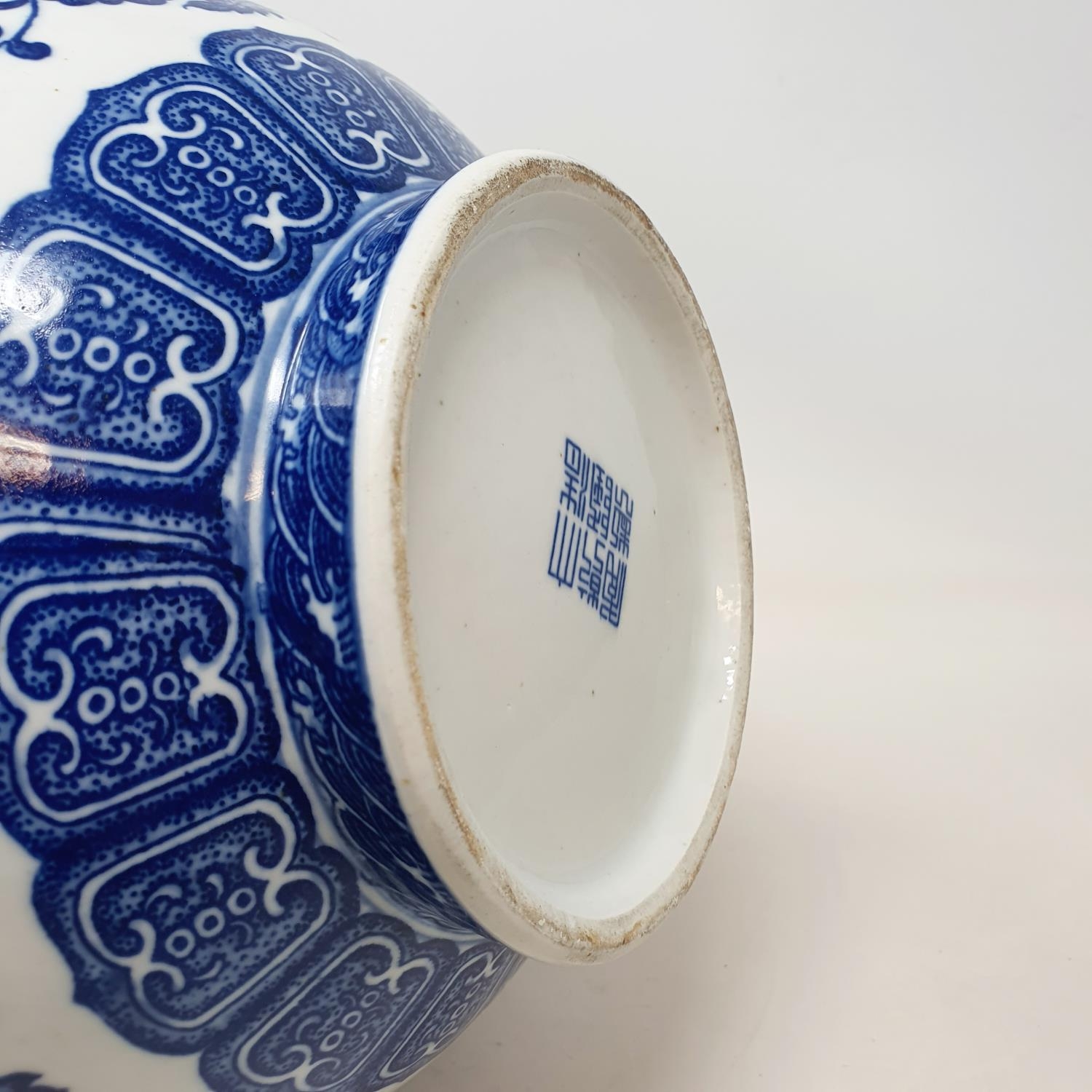 A Chinese blue and white bottle vase, decorated flowers in underglaze blue, bears a Qianlong mark, - Image 12 of 13