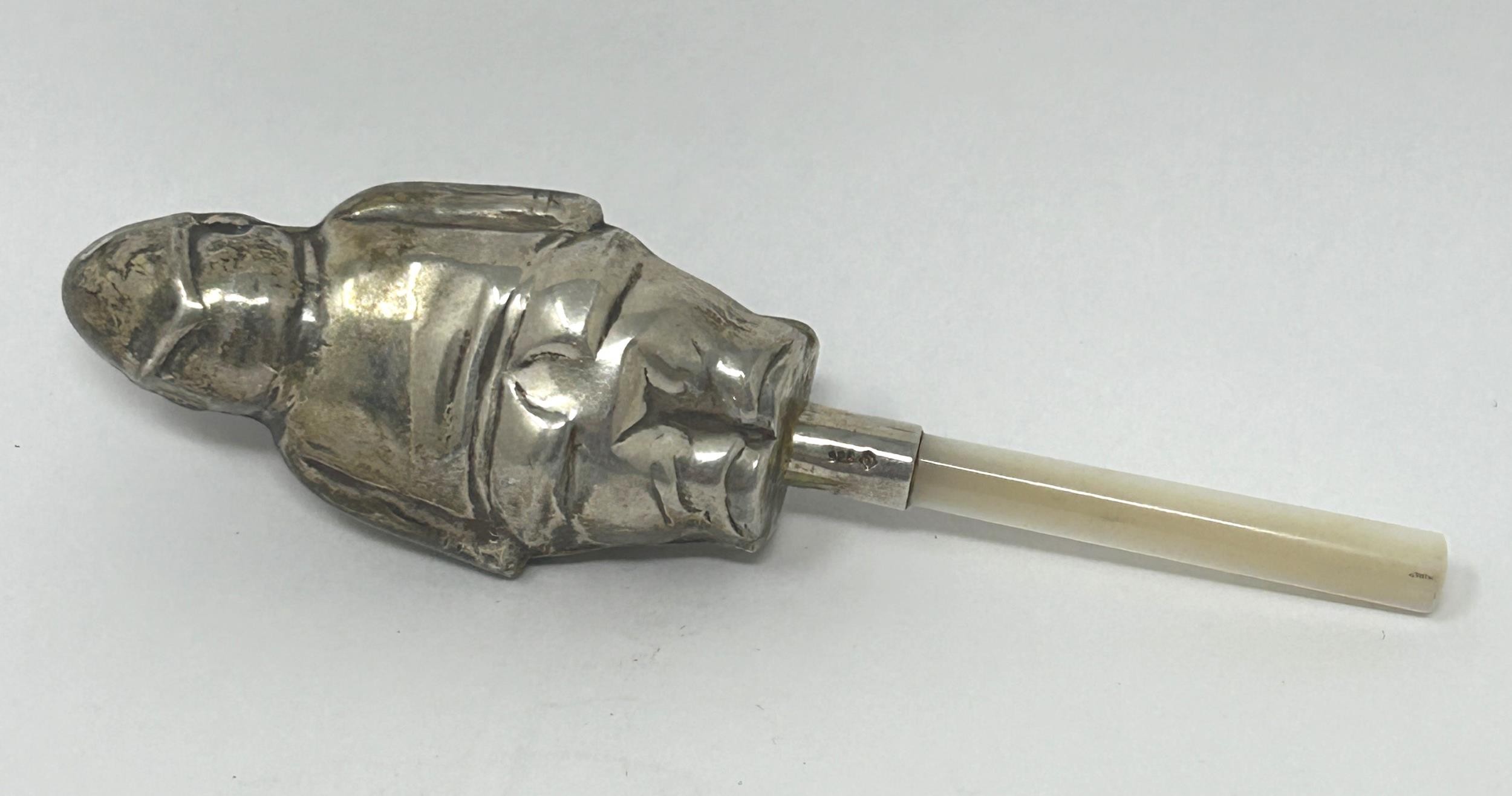 A silver coloured metal and mother of pearl novelty baby's rattle, in the form of a fireman - Image 2 of 3