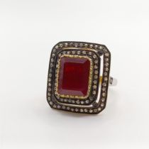 A large vintage style step-cut ruby and double diamond frame ring, in silver gilt, ruby 5.21ct,