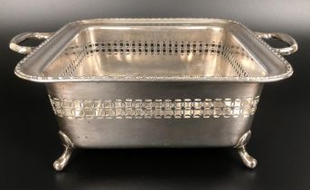 A silver plated pierced stand