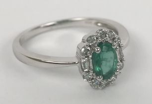 An oval cut emerald ring, with RBC and baguette cut diamonds, emerald 0.45ct, diamonds 0.25ct,