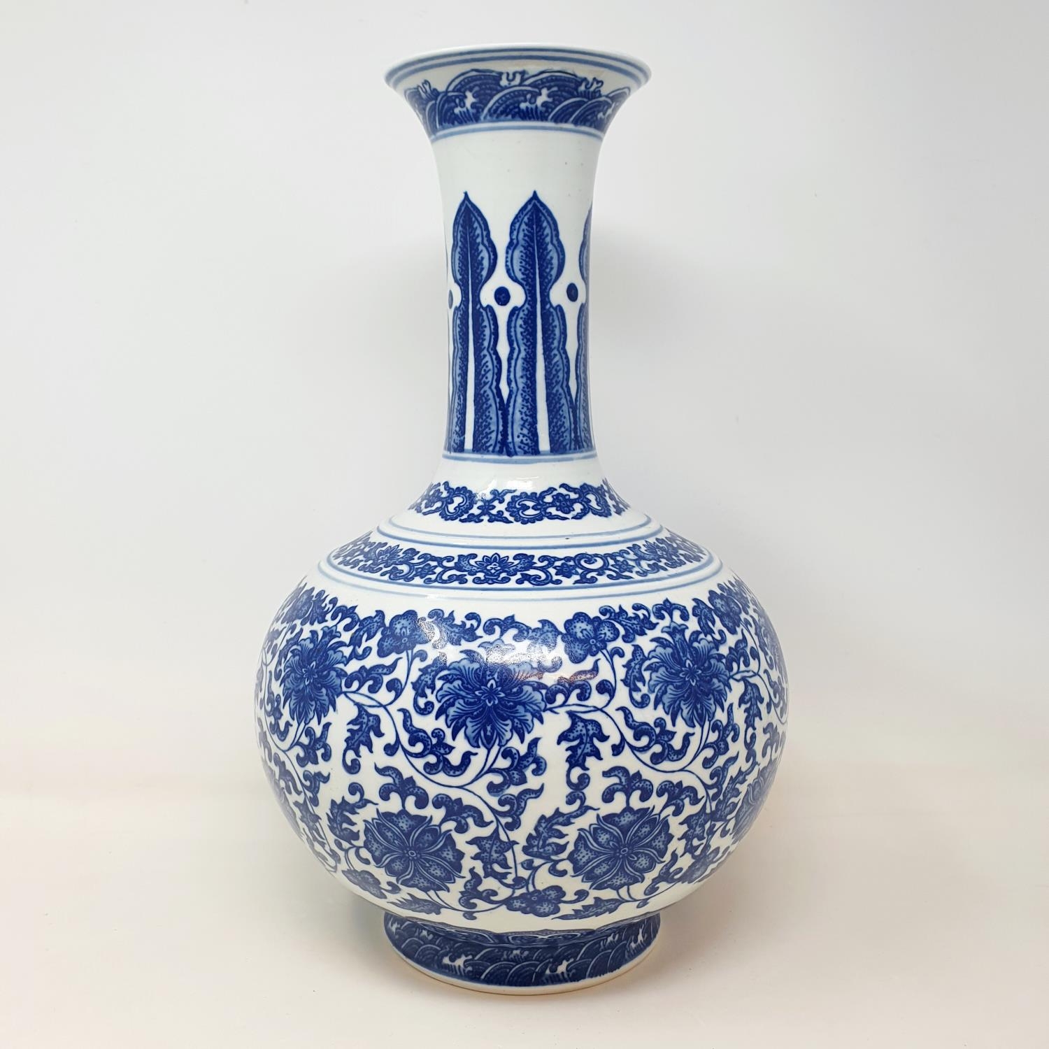 A Chinese blue and white bottle vase, decorated flowers in underglaze blue, bears a Qianlong mark, - Image 3 of 13