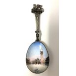 A Continental silver and enamel presentation spoon, with a Florentine style scene and a griffin