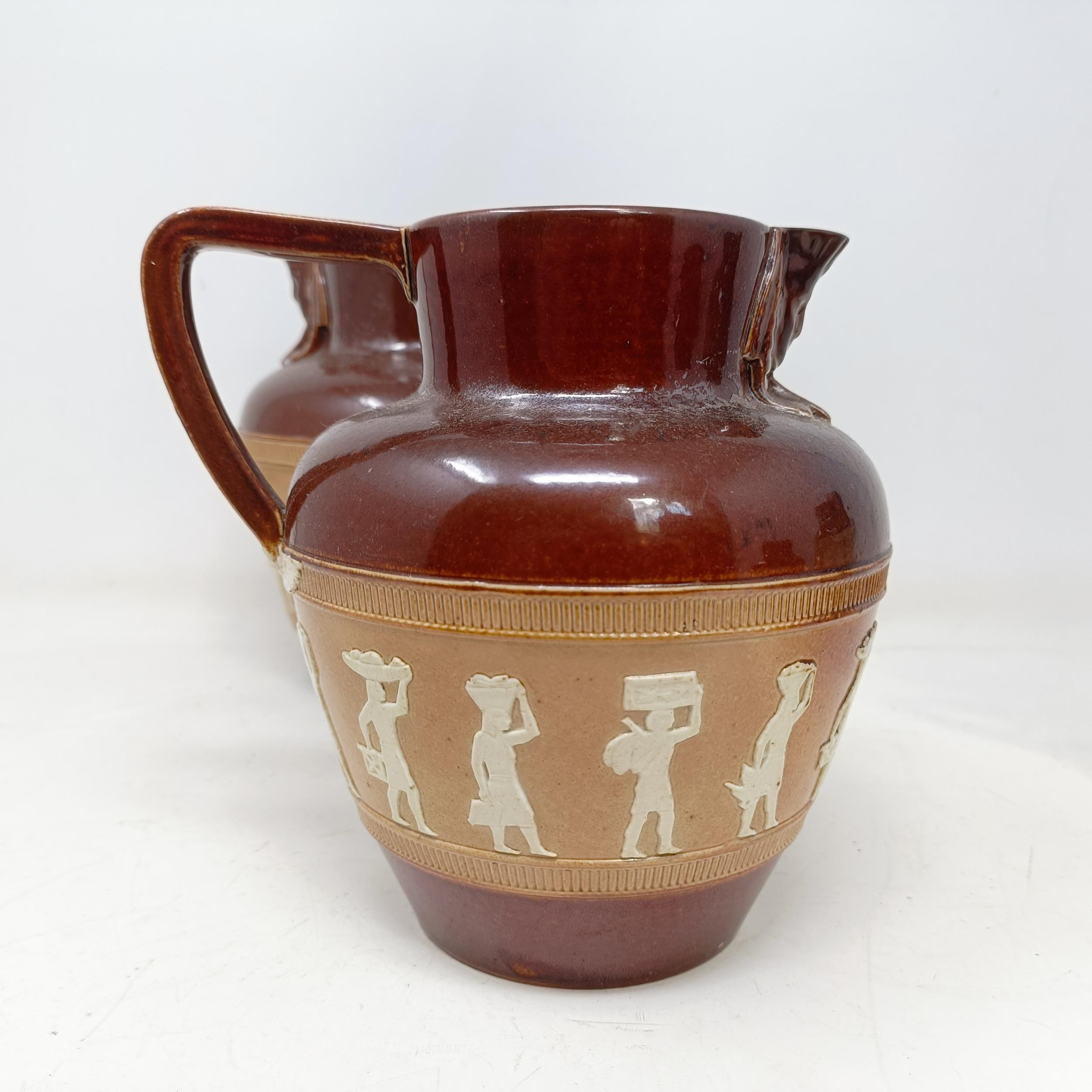 A graduated set of Doulton Lambeth jugs, 20 cm, 18 cm and 14 cm, and another similar, 18 cm (4) - Image 12 of 25