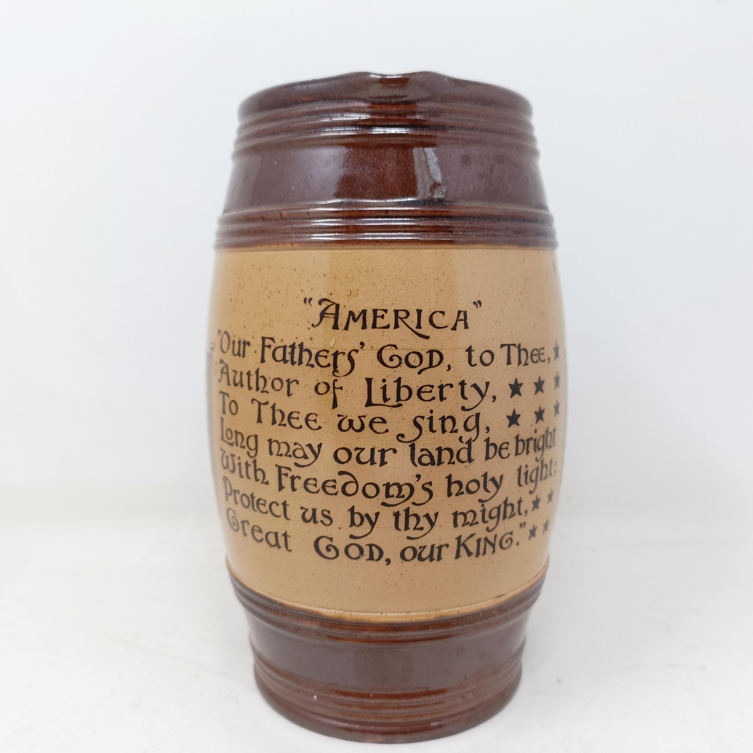 A Doulton Lambeth jug, inscribed with motto, 'America Our Fathers God To Thee Author Of