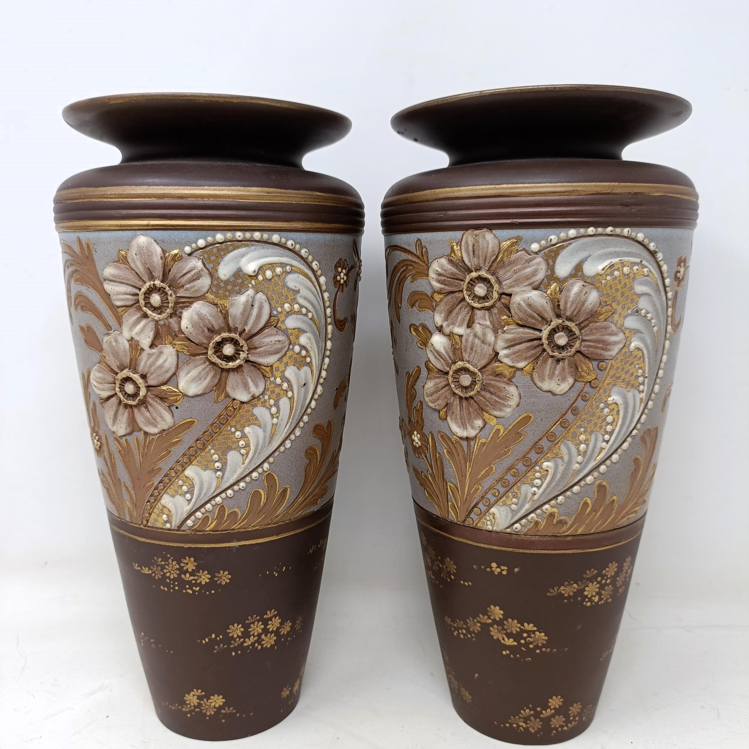 A pair of Doulton Slater vases, decorated flowers, 26 cm high (2) No chips cracks or restoration