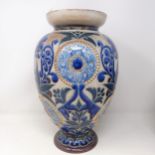 A Doulton Lambeth vase, by Elsa Simmance, decorated flowers, 37 cm high Base is cracked and glued