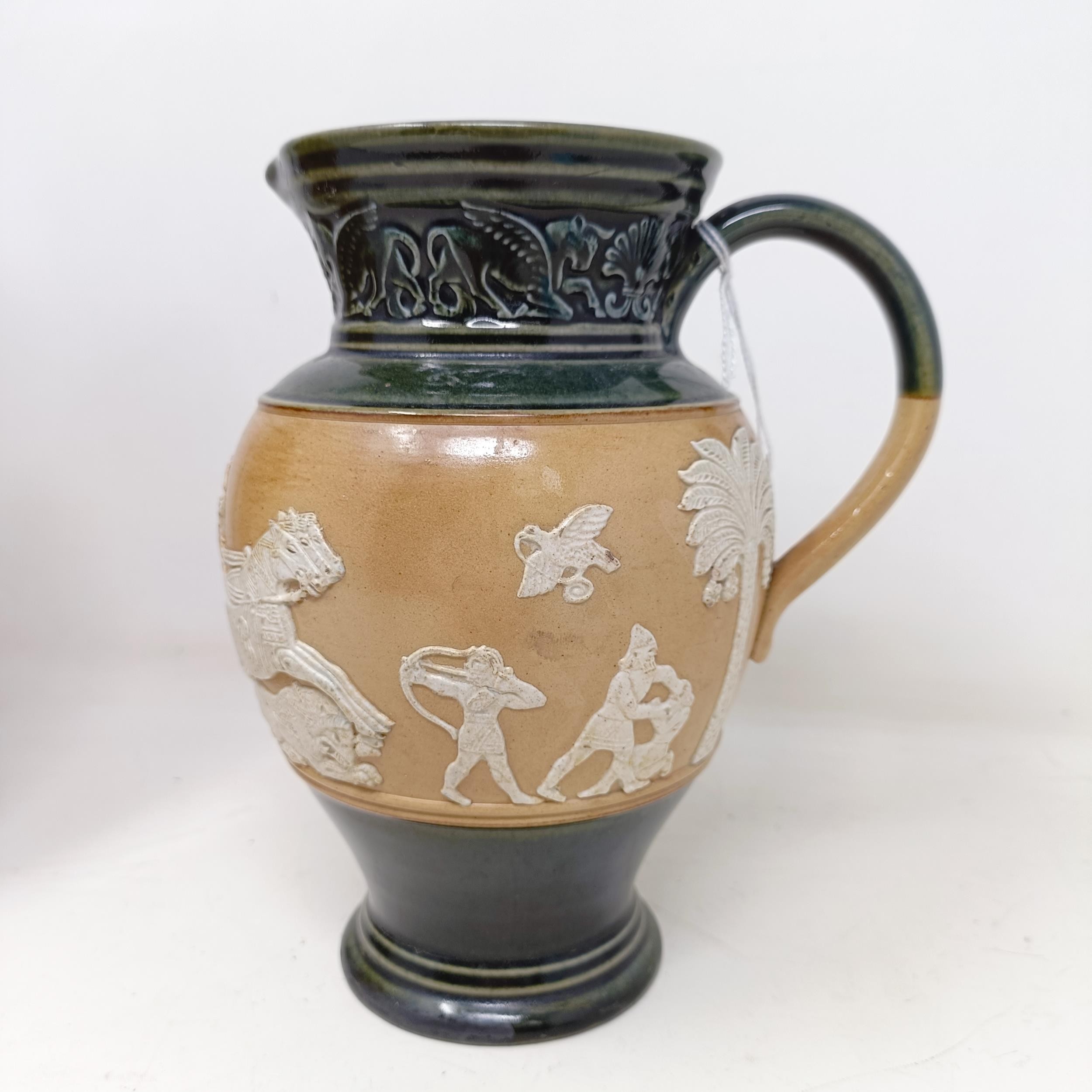 A Doulton Lambeth jug, decorated in Egyptian manner, 20 cm A few rough areas to the touch to the - Image 3 of 8