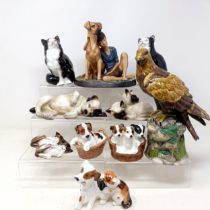 A Royal Doulton figure of a Golden Eagle, RDA36, Buddies HN2546, a figure of a reclining dog, and