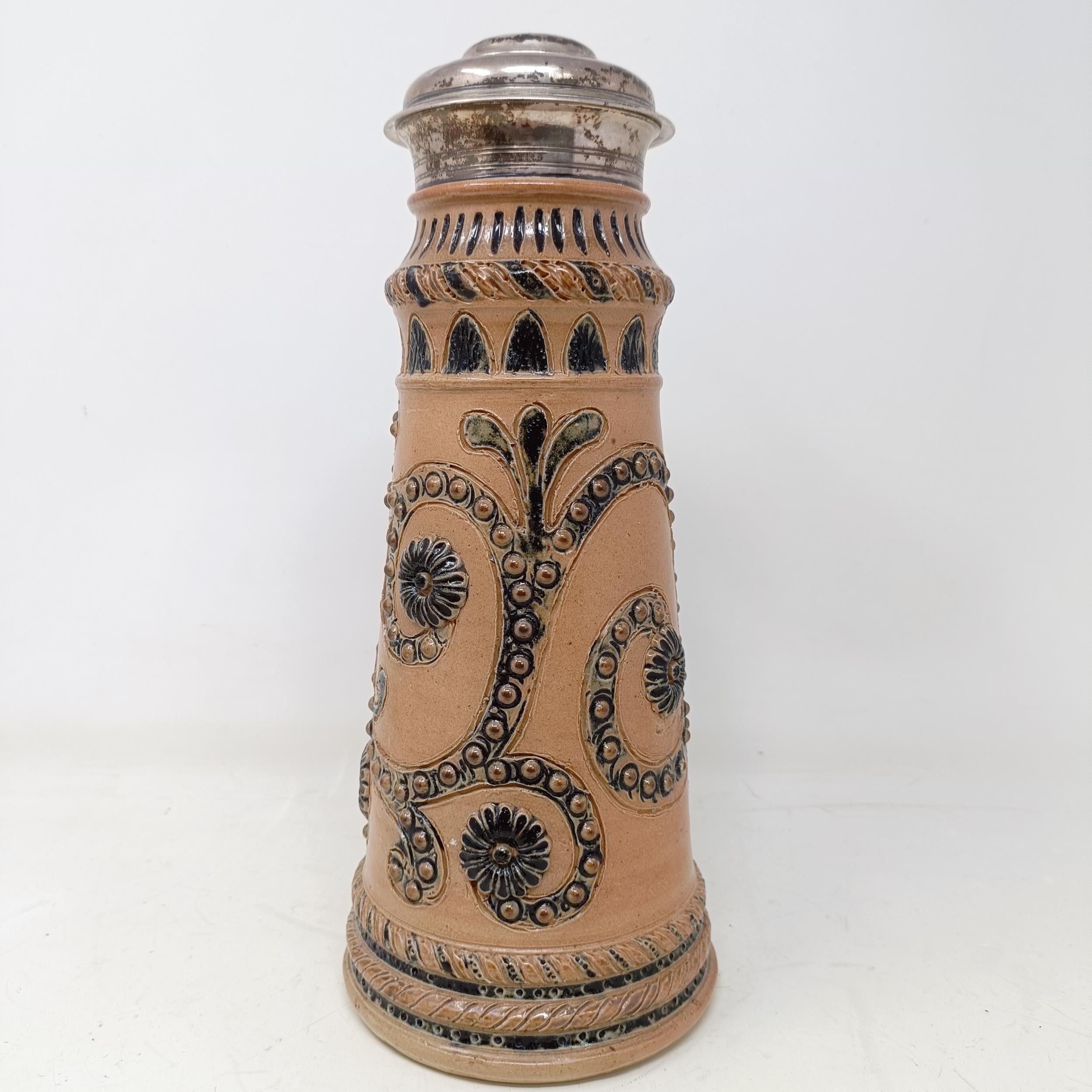 A Doulton Lambeth stoneware flagon, with a silver mount, London 1866, 30 cm high Handle crudely - Image 2 of 10
