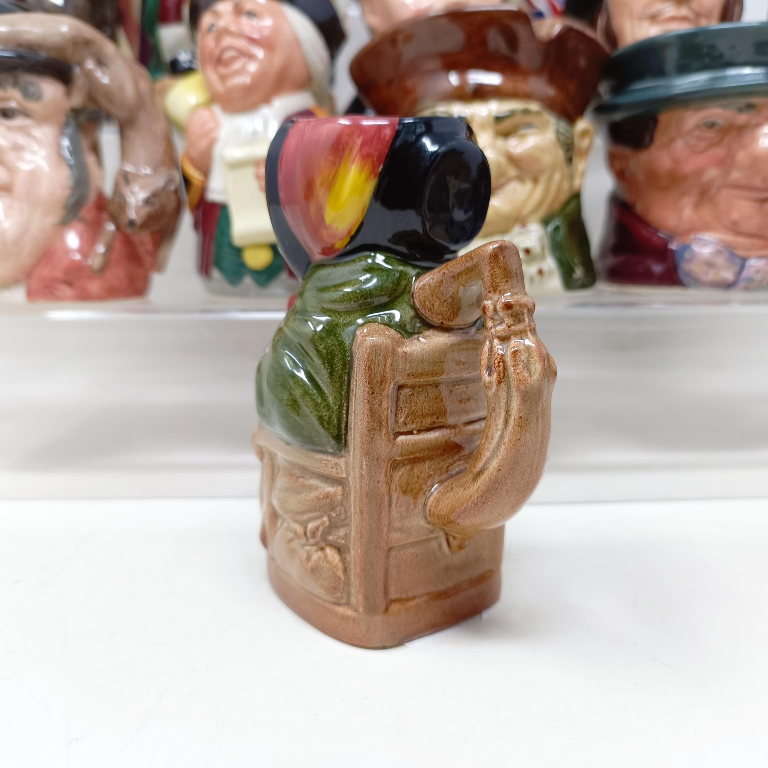 A Royal Doulton character jug, Robinson Crusoe D6532, Beefeater D6206, a Royal Doulton figure, The - Image 11 of 35