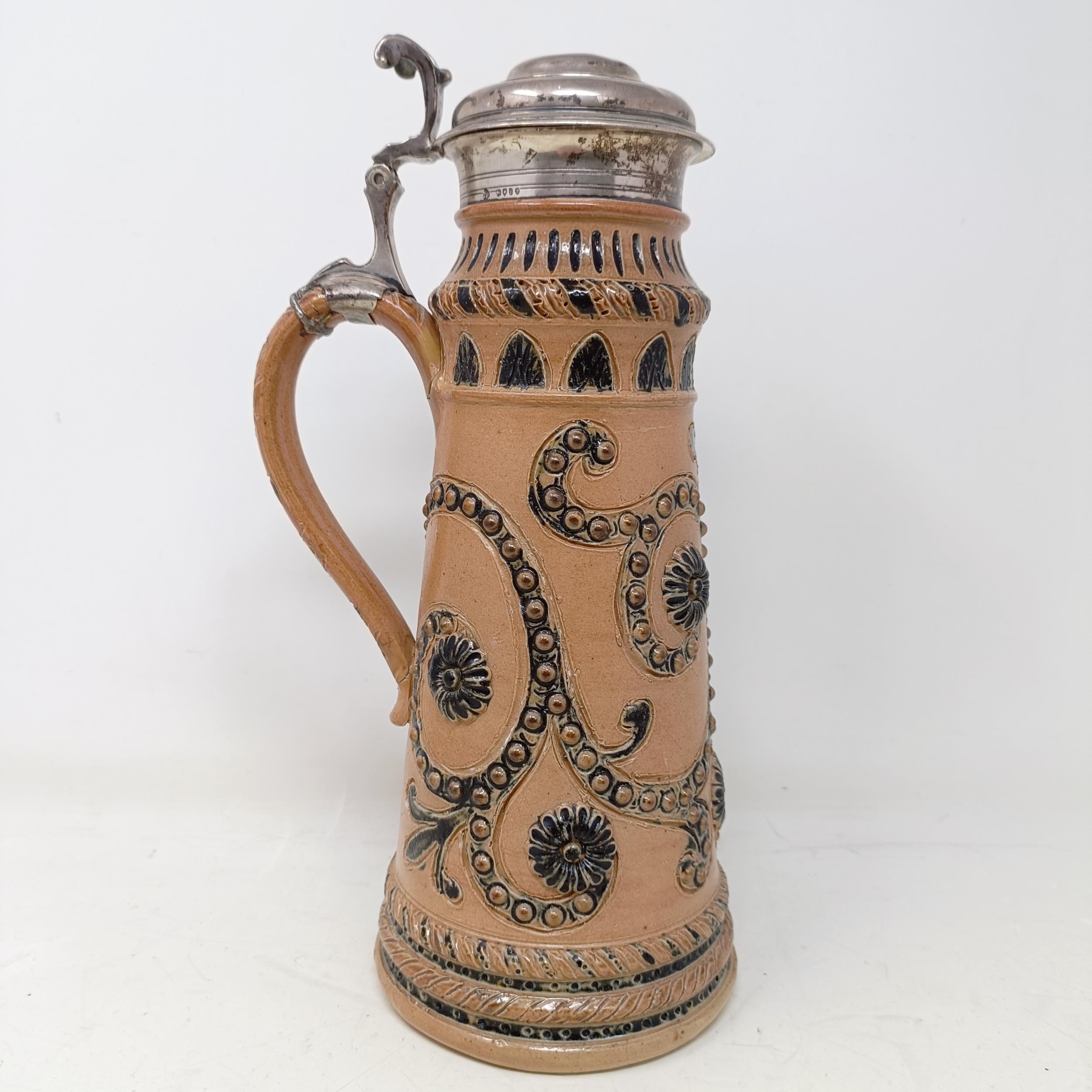 A Doulton Lambeth stoneware flagon, with a silver mount, London 1866, 30 cm high Handle crudely - Image 3 of 10