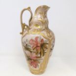 A Doulton Lambeth ewer, by Frank A Butler, decorated with flowers, highlighted in gilt, 30 cm high