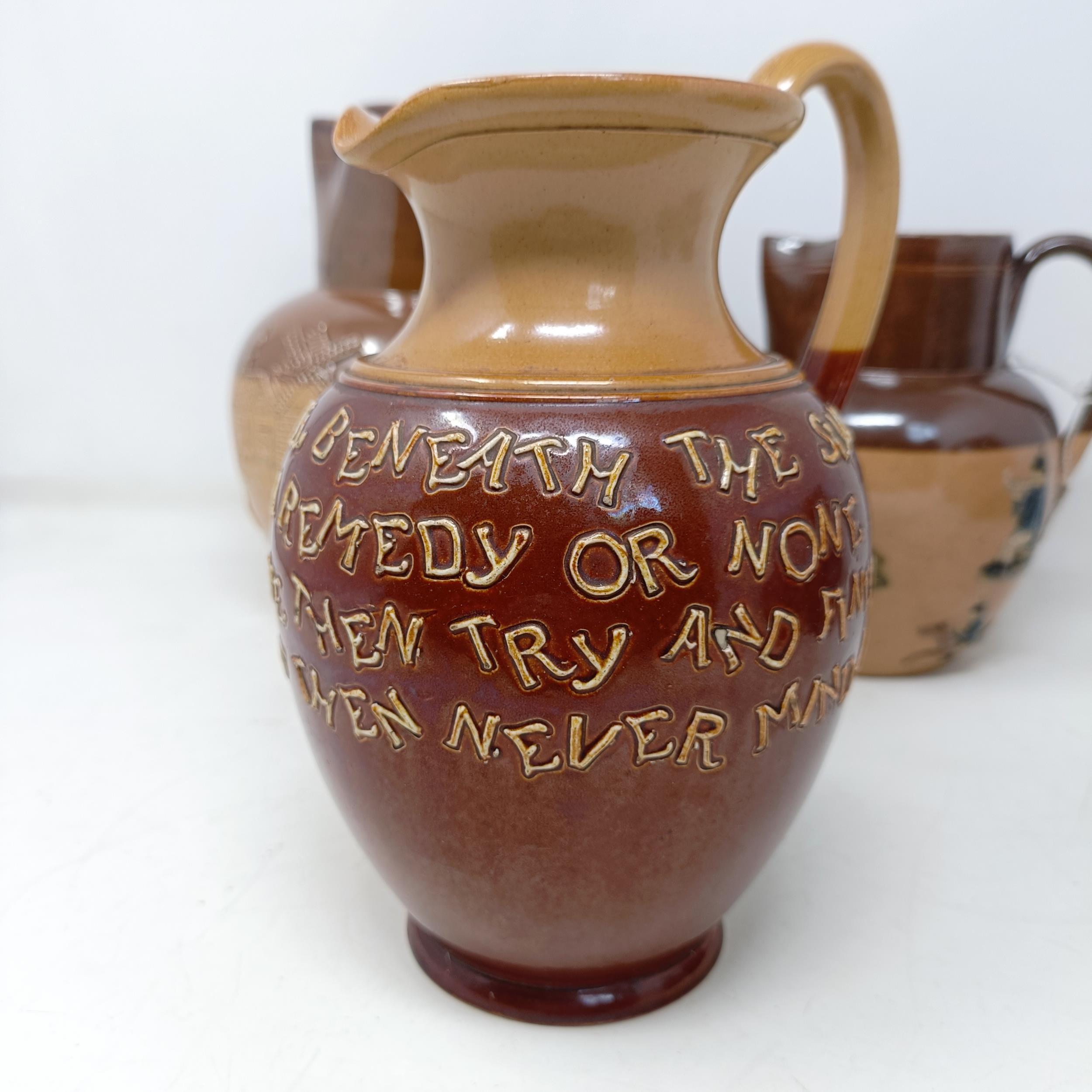 A Doulton Lambeth jug, with a motto, 'For Every Ill Beneath The Sun There Is A Remedy Or None...' 18 - Image 12 of 27