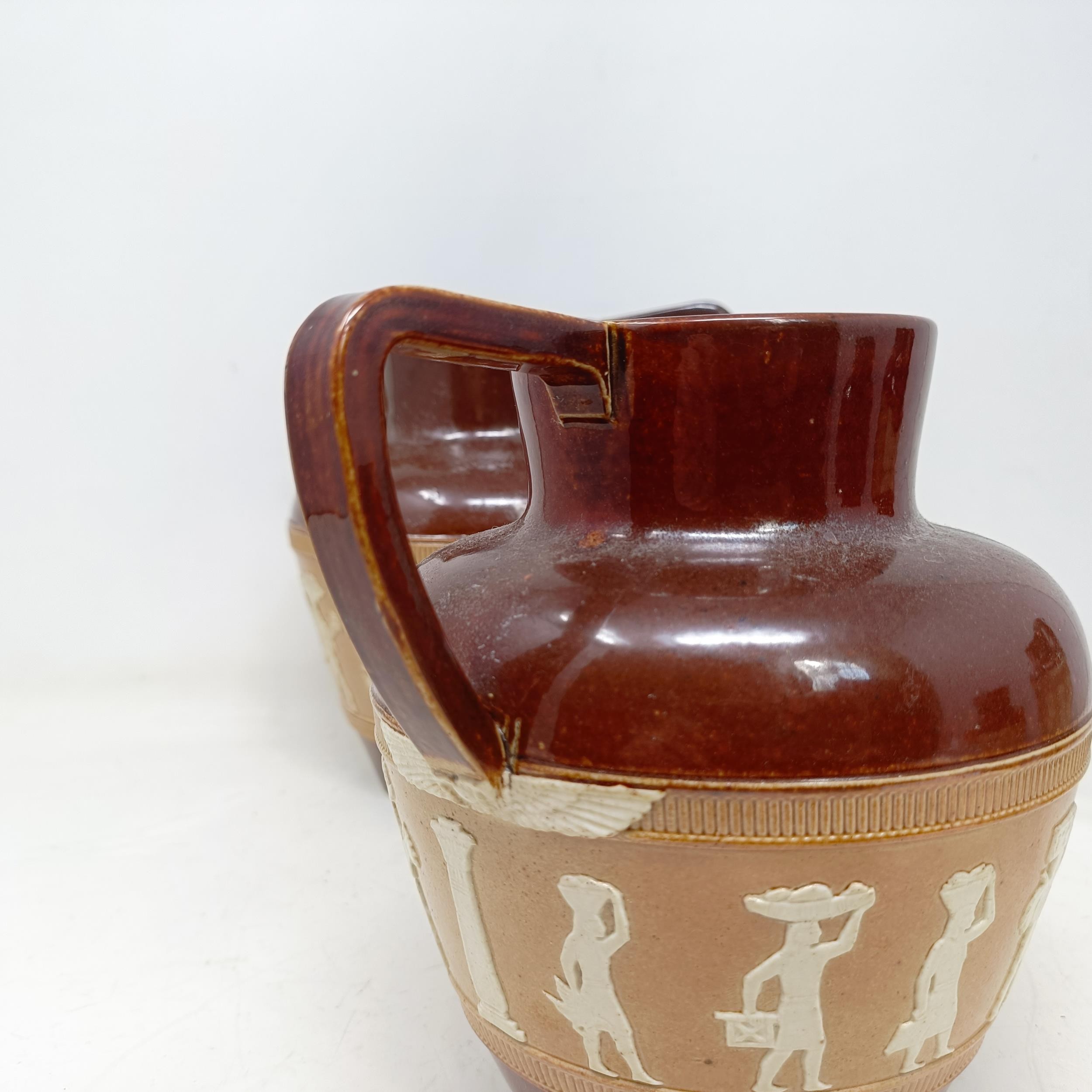 A graduated set of Doulton Lambeth jugs, 20 cm, 18 cm and 14 cm, and another similar, 18 cm (4) - Image 13 of 25