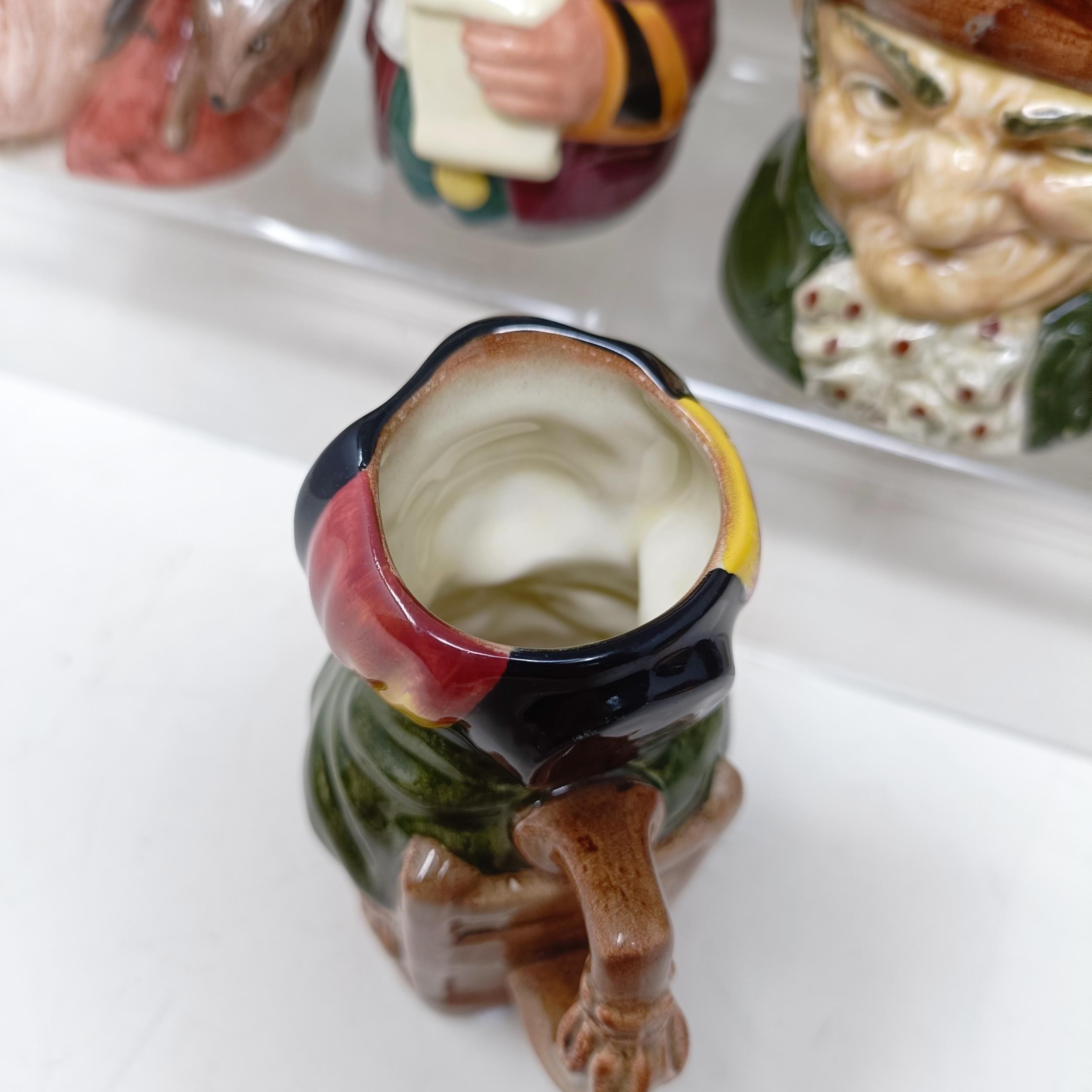 A Royal Doulton character jug, Robinson Crusoe D6532, Beefeater D6206, a Royal Doulton figure, The - Image 12 of 35