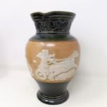 A Doulton Lambeth jug, decorated in Egyptian manner, 20 cm A few rough areas to the touch to the