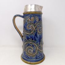 A Doulton Lambeth jug, by George Tinworth, decorated floral motifs, with a silver mount, marks