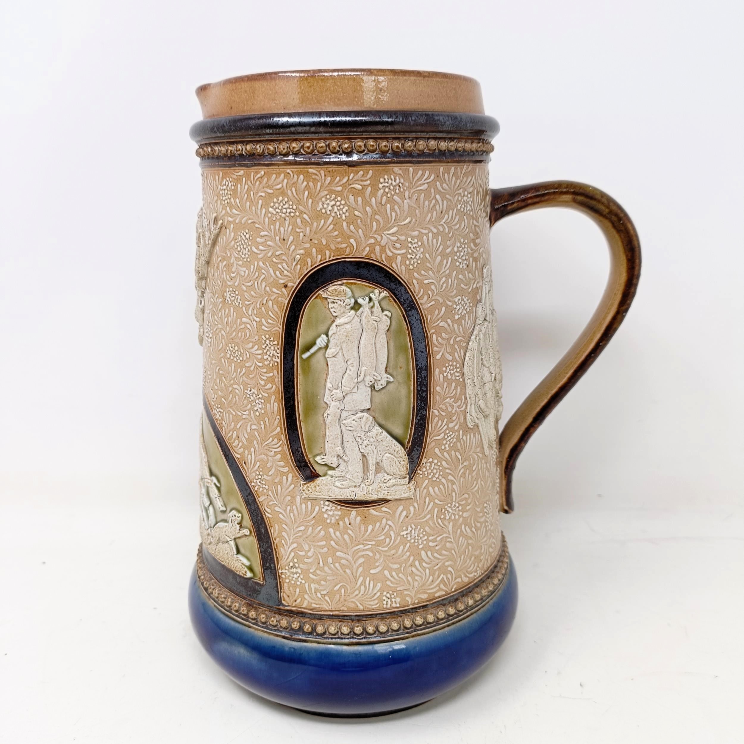 A Doulton Lambeth jug, by Harriet Hibbut, decorated hunting scenes, 22 cm high No chips, cracks or