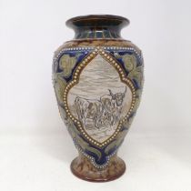 A Royal Doulton vase, by Hannah Barlow, decorated with cows, 27 cm high Chip to base, most of