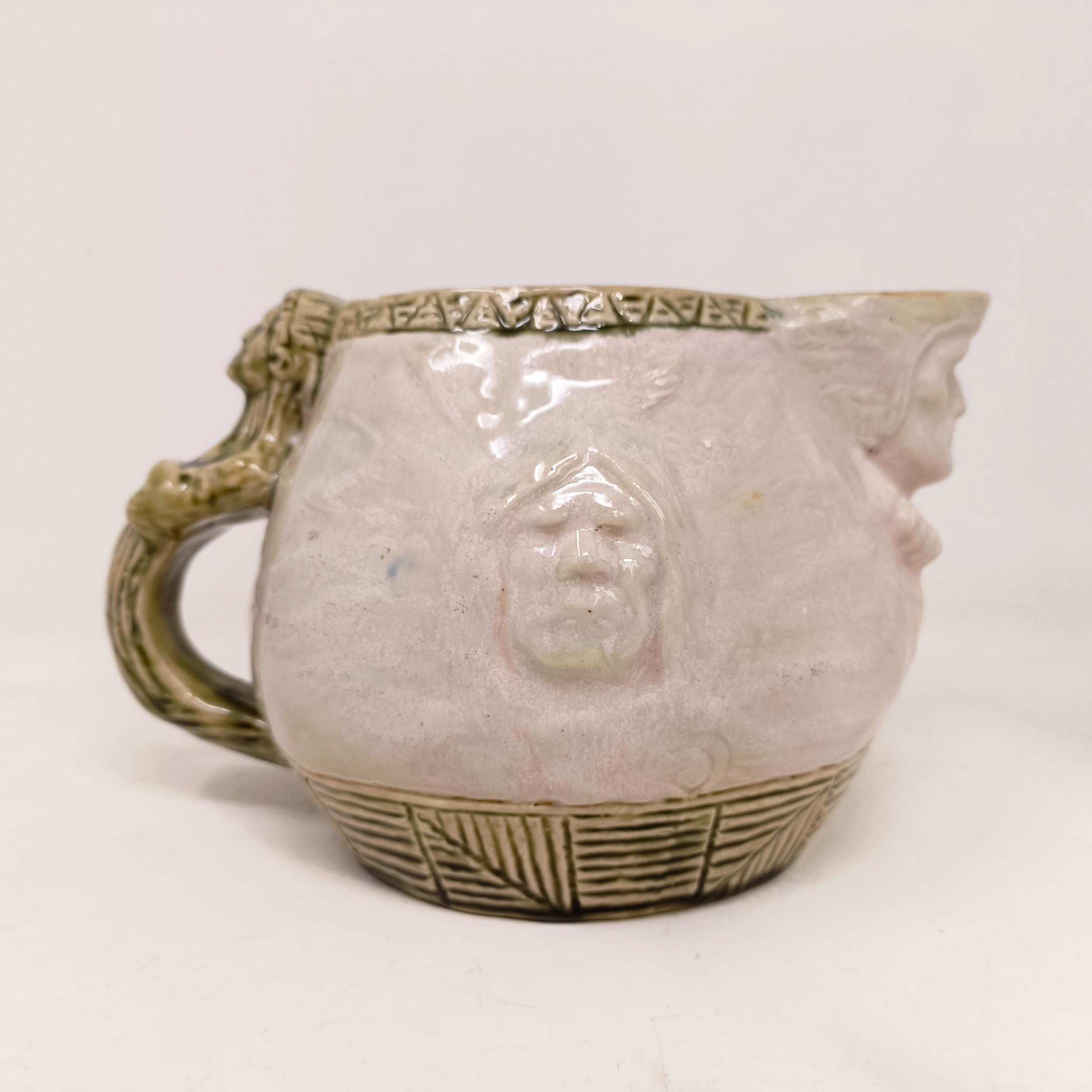 A Doulton Lambeth jug, by Edward Kemeys, decorated with native American Indians, 13 cm high - Image 4 of 9