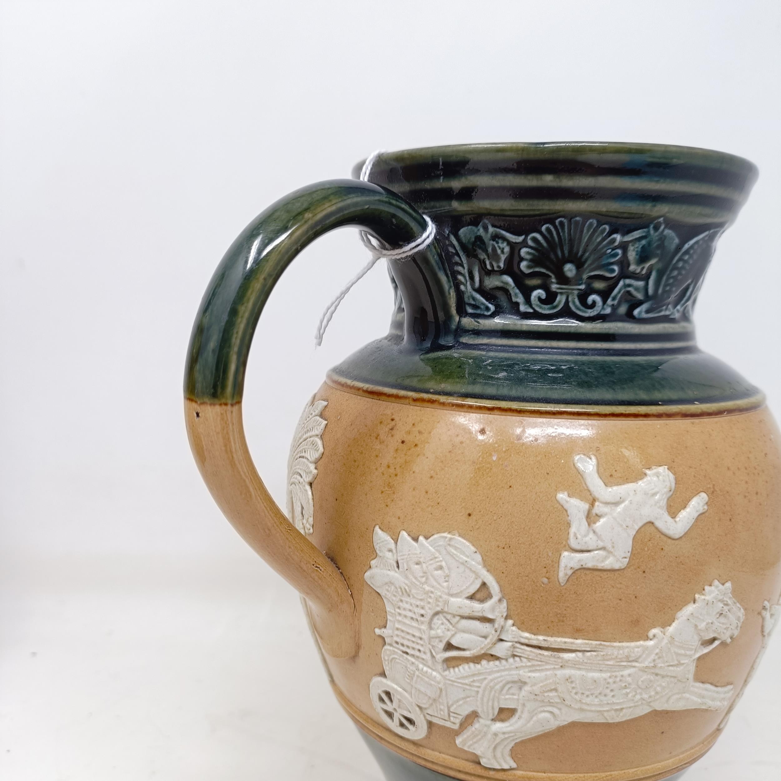 A Doulton Lambeth jug, decorated in Egyptian manner, 20 cm A few rough areas to the touch to the - Image 5 of 8