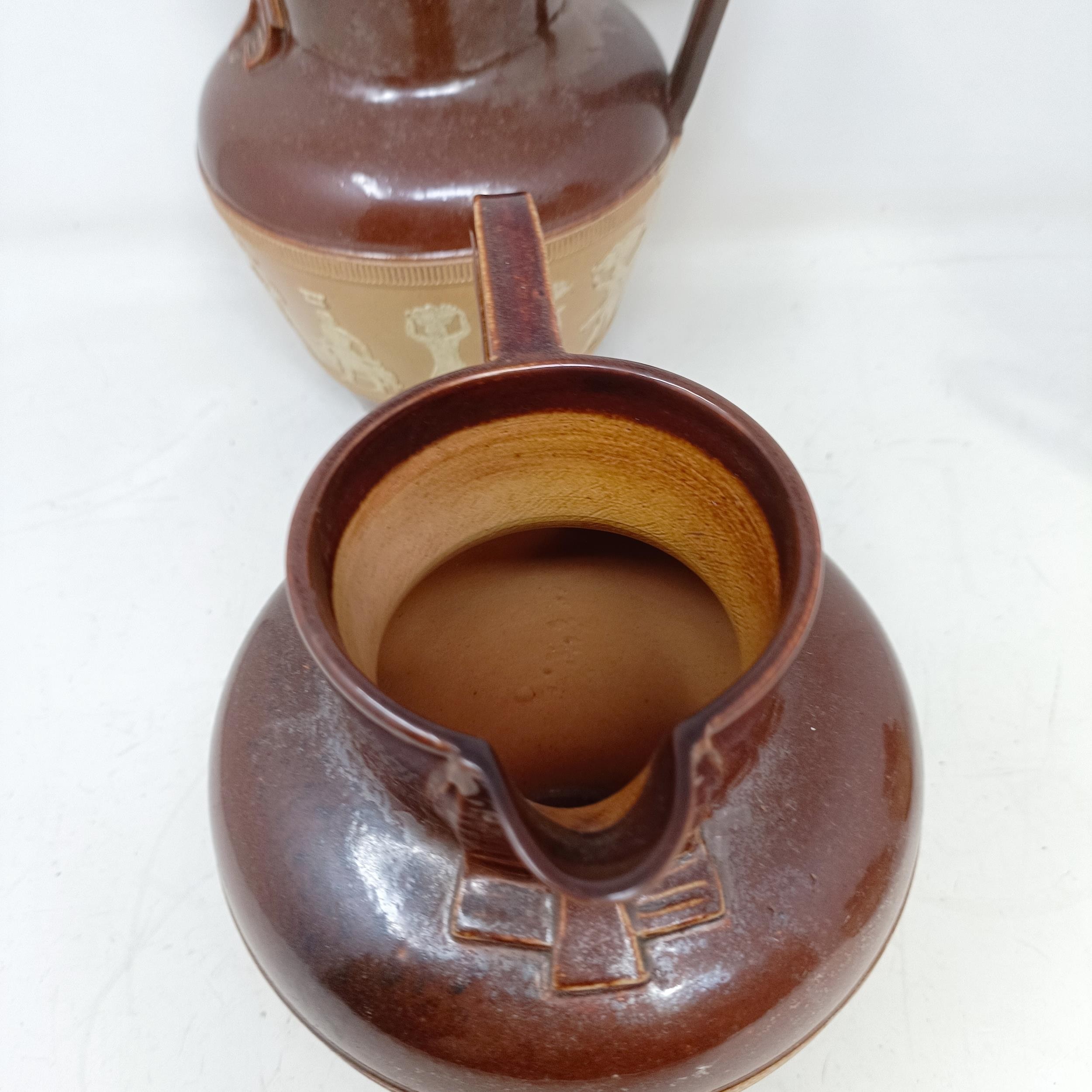 A graduated set of Doulton Lambeth jugs, 20 cm, 18 cm and 14 cm, and another similar, 18 cm (4) - Image 15 of 25