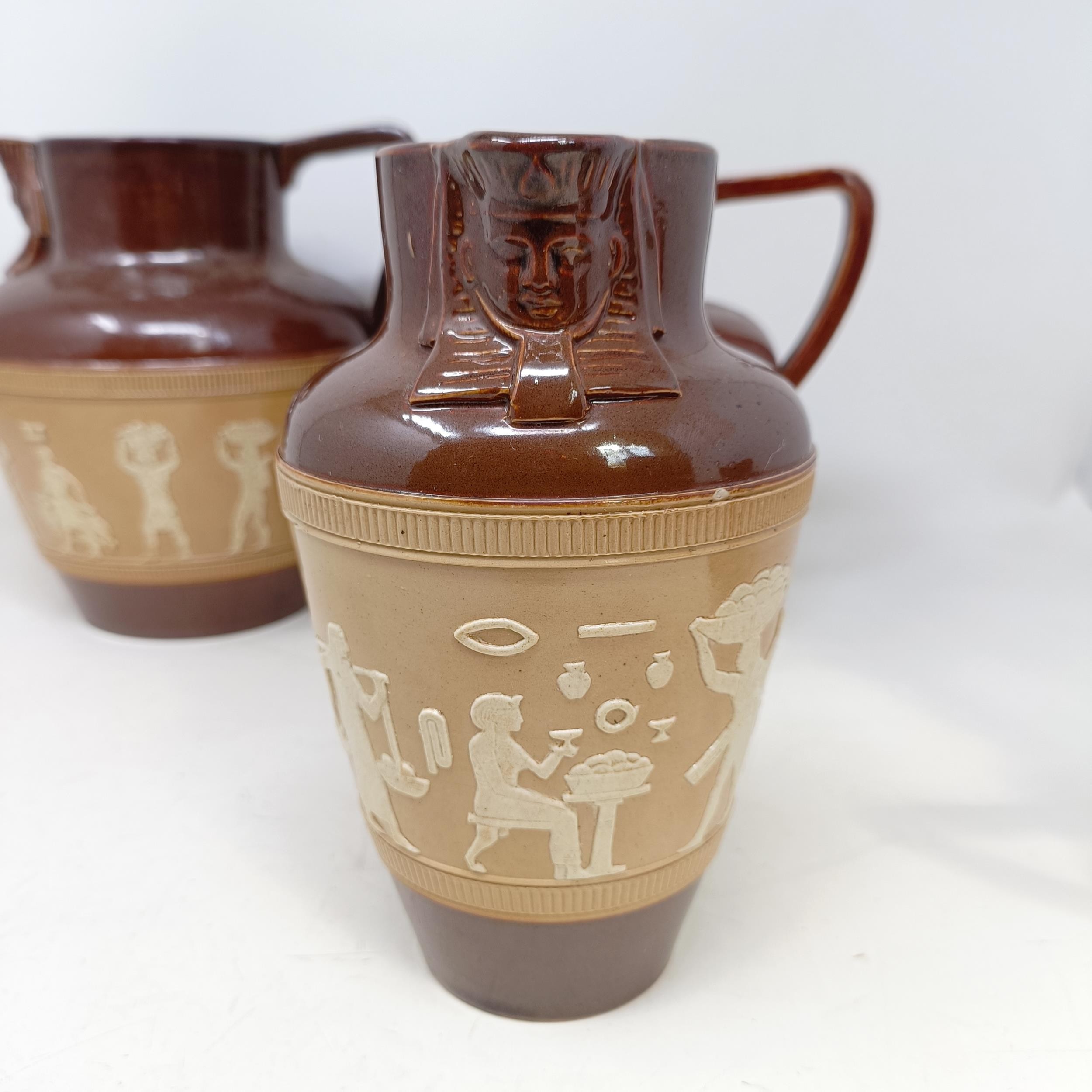 A graduated set of Doulton Lambeth jugs, 20 cm, 18 cm and 14 cm, and another similar, 18 cm (4) - Image 7 of 25
