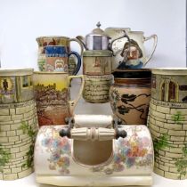 A pair of Royal Doulton Series Ware vases, in the form of castles, a jug, inscribed 'They All Love