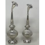 A pair of silver coloured metal Eastern rosewater sprinklers, 22 cm high, 232 g